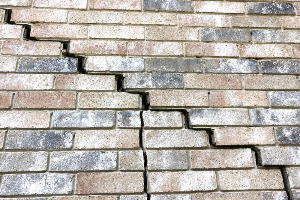 cracked brick wall indicating house might need house leveling