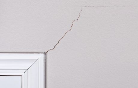 diagonal crack above door